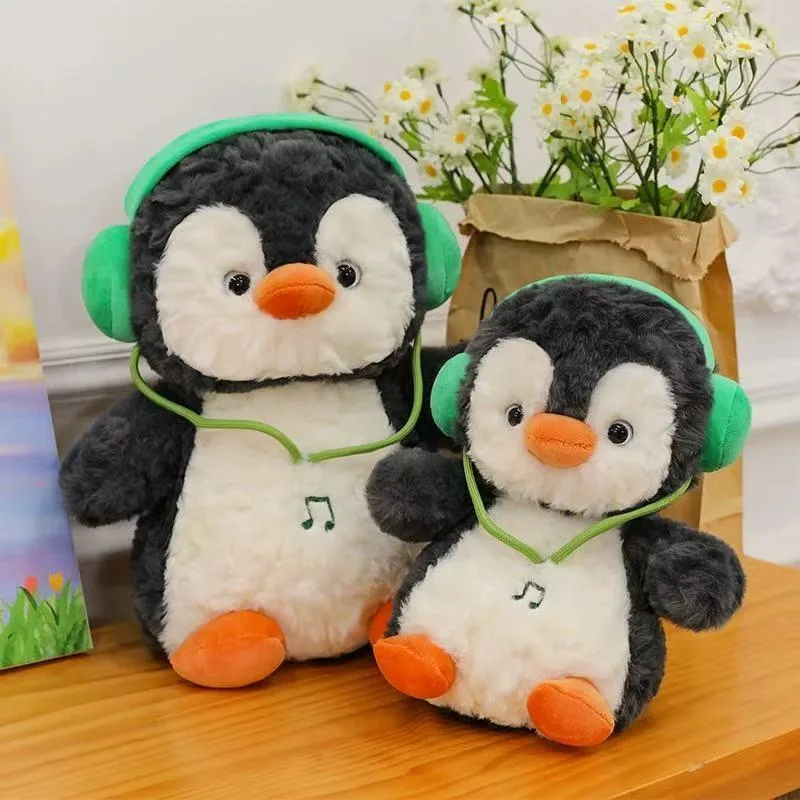 Pinguim com fones de ouvido · Pelúcia · 40 cm